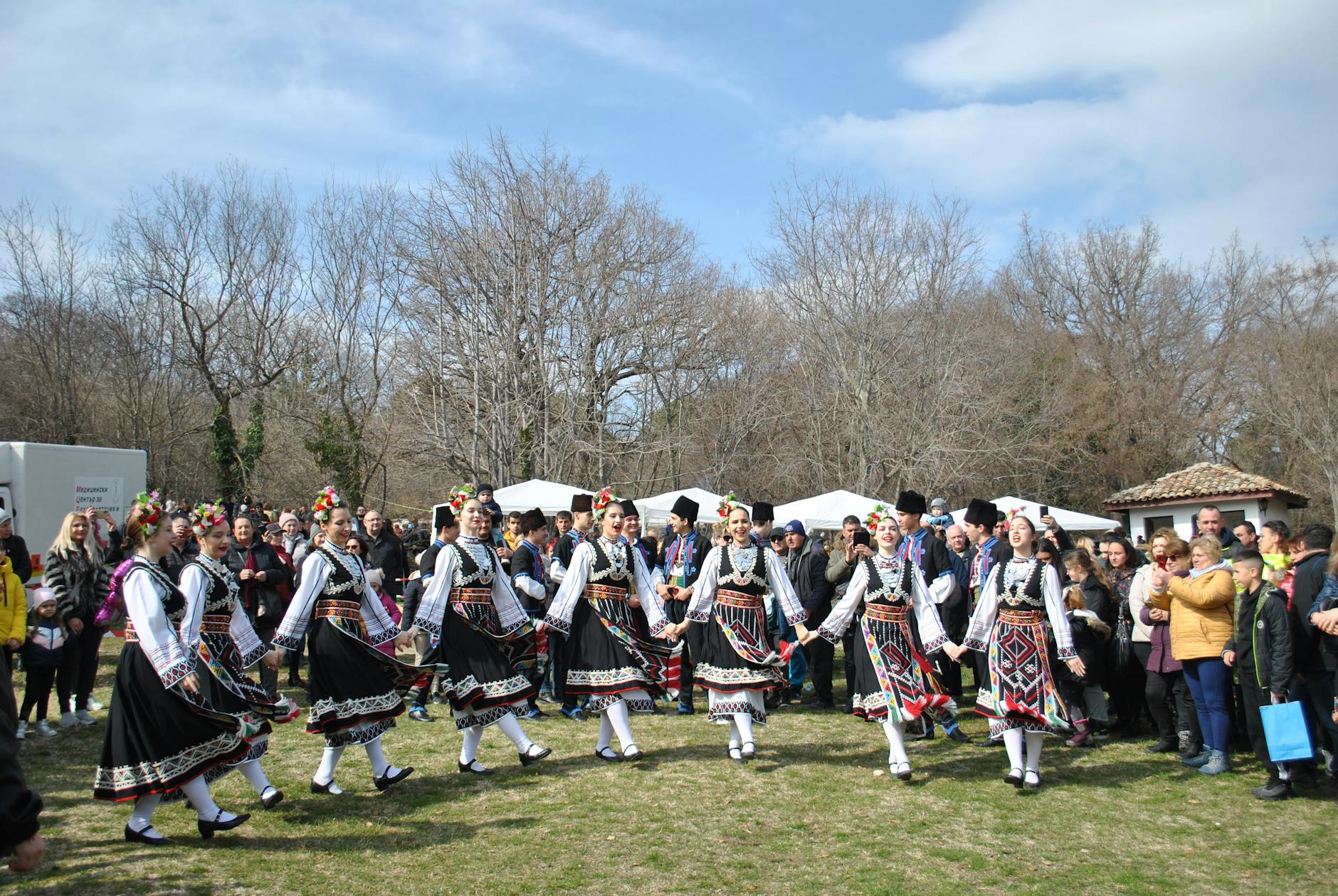 traditional folk dance performance in park gathering