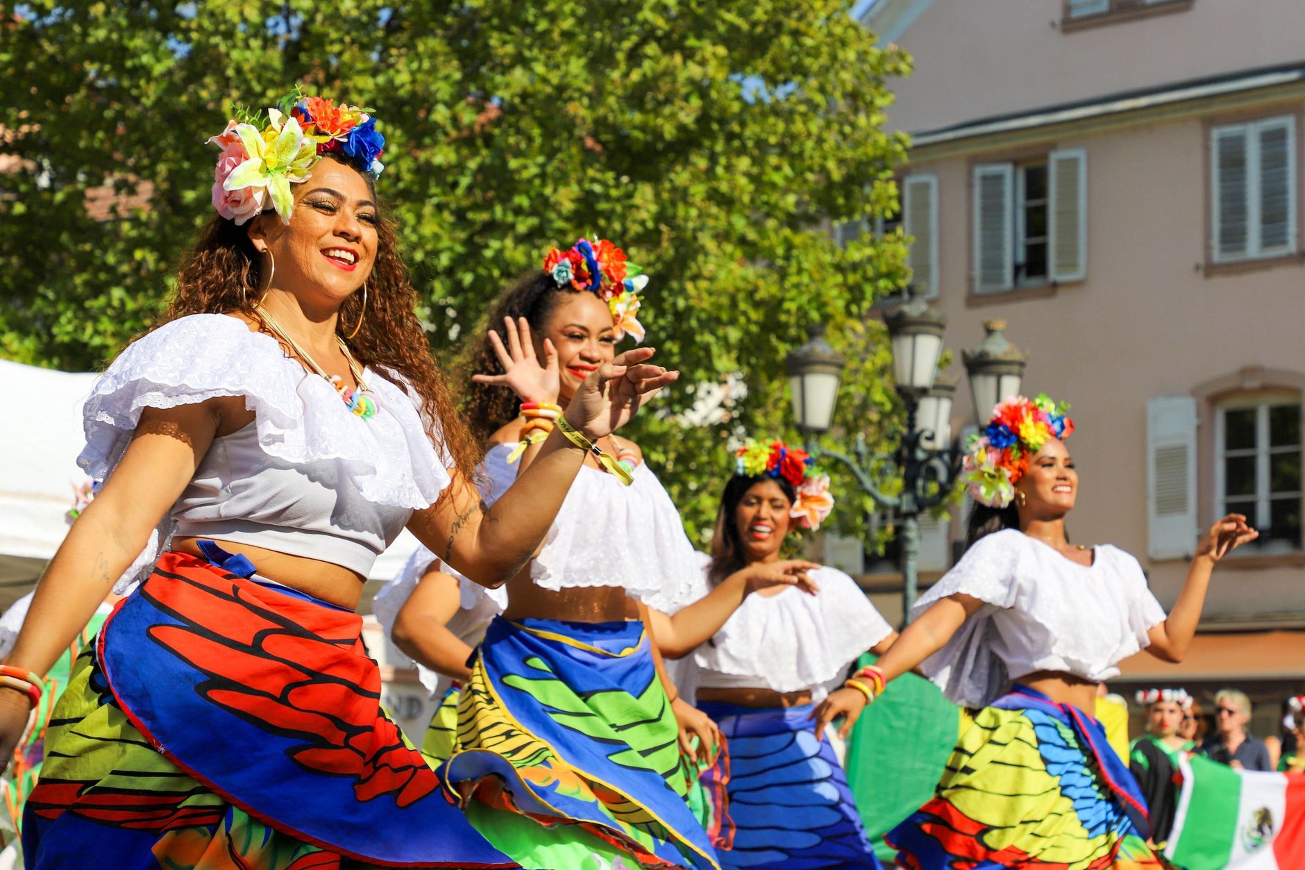 smiling women dancing in traditional clothing